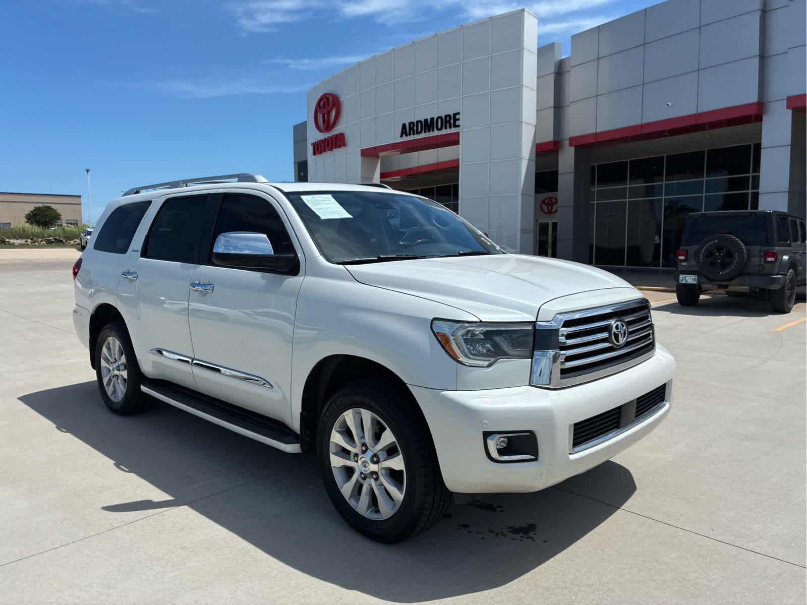 2018 Toyota Sequoia Platinum in Blizzard Pearl — front three-quarter view